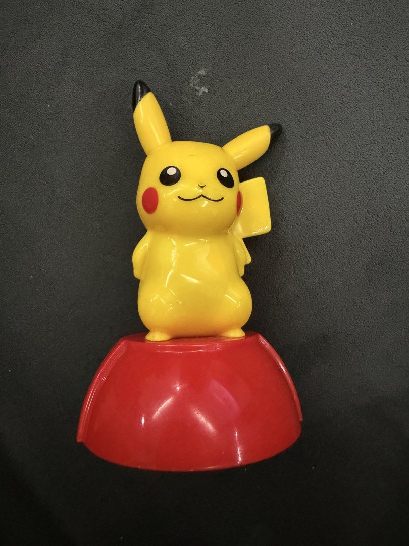 2012 Pikachu Figure Toy (Category: Character Goods) located in Lipa City. Submitted by cokelight11 (Listing ID 1469690752, Image 1). Description: - McDonald's Pikachu Figure - Release Year: 2012 - Authenticity: Nintendo, Pokémon, and McDonald's copyright stamps on the bottom - Condition: Minor scuffs from handling and play; wheels roll smoothly - Perfect for Pokémon collectors and franchise fans.