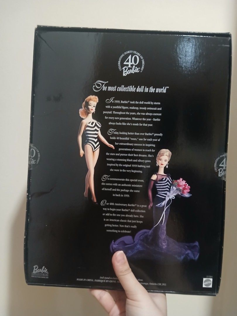 40th Anniversary Barbie Collector Edition Doll (Category: Figurines & Statues) located in Subic. Submitted by frncnjntmr22 (Listing ID 1469741496, Image 3). Description: - Edition: Collector Edition 40th Anniversary Barbie - Outfit: Stunning black dress with glittery silver bodice details, black gloves, and drop earrings - Accessories: Includes a bouquet of pink roses and a miniature replica of the original 1959 bathing suit doll - Condition: Ori