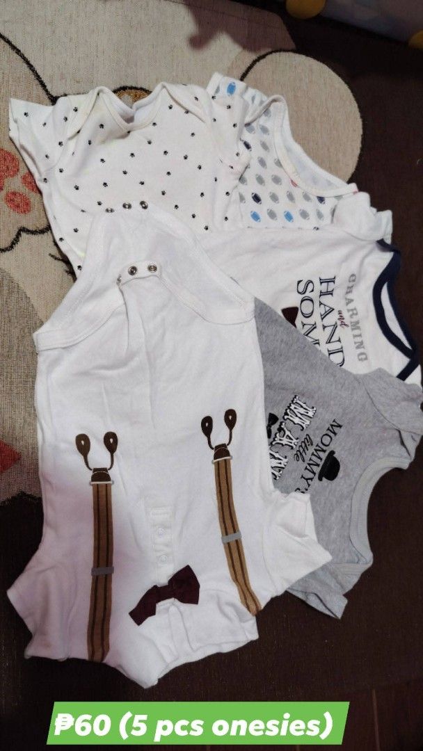 5 pcs baby onesies set (Category: Babies & Kids Fashion) located in Quezon City. Submitted by livebird_b3d174 (Listing ID 1469744653, Image 1). Description: - Set of 5 adorable baby onesies - Assorted cute designs: brown paw prints, football pattern, text prints, and a white one with printed suspenders and bowtie - Convenient snap button closures at the bottom for quick diaper changes - Soft and comfortable fabric ideal for everyday baby wear - G