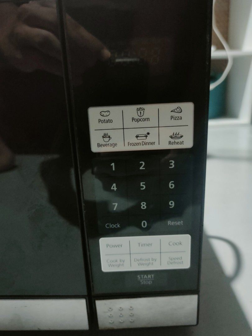 700 Watts Black and Silver Digital Microwave Oven (Category: Ovens & Toasters) located in Manila. Submitted by billythekid05 (Listing ID 1469679570, Image 2). Description: - Color & Design: Sleek black and silver finish with digital display - Power: 700 watts for quick and efficient cooking - Included: Glass turntable plate and standard plug - Convenient Presets: Quick-touch buttons for potato, popcorn, pizza, beverage, frozen dinner, and reheat 
