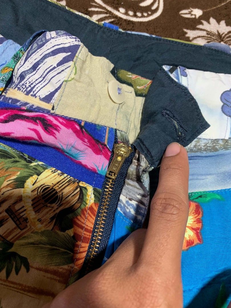 90s Patchwork Tropical Hawaiian Print Casual Shorts (Category: Shorts) located in Bislig. Submitted by rndm_stff1 (Listing ID 1469616094, Image 2). Description: Statement-making patchwork shorts featuring an eclectic mix of vintage tropical prints, from vibrant hibiscus flowers to palm tree beaches and island landscape. Built with a clean waistband, belt loops, button fly, and functional rear pockets. Perfect for summer getaways, resort wear, or 