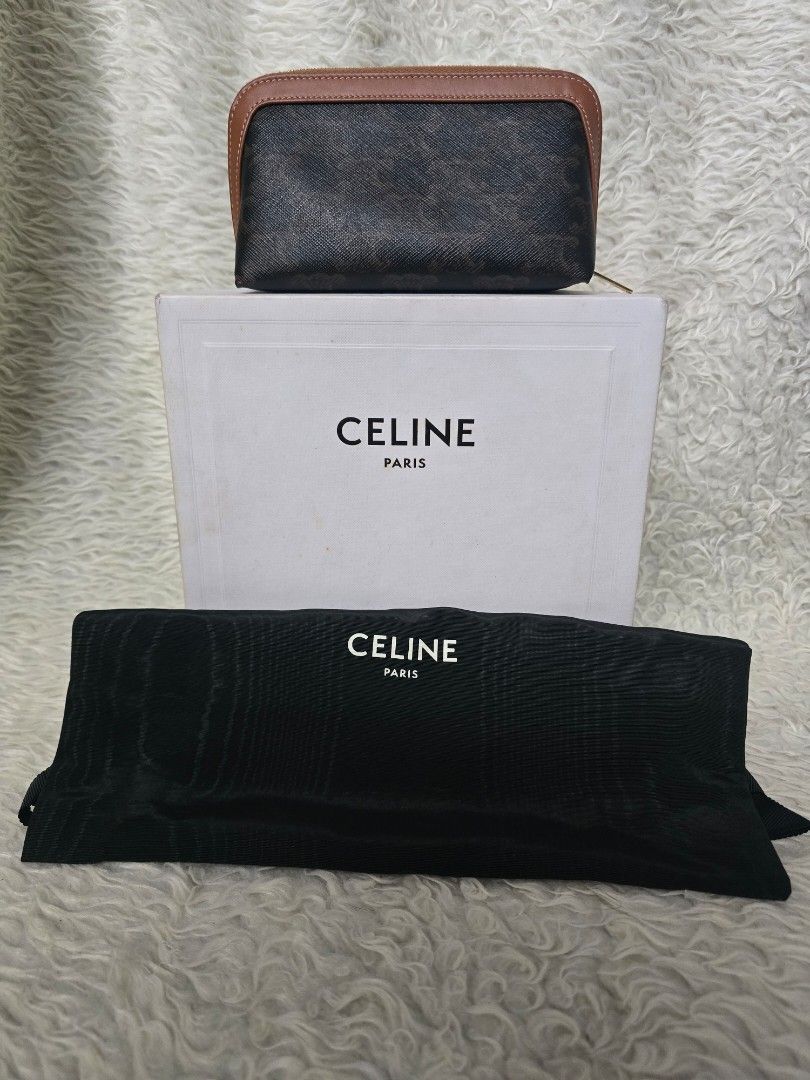 💯% AUTHENTIC Celine Triomphe Canvas Pouch with Box and Dust Bag (Category: Luxury Bags & Wallets) located in Marikina City. Submitted by dust.end.bags (Listing ID 1469609729, Image 1). Description: - Authentic Celine pouch in dark monogram canvas - Elegant brown leather trim with top zip closure - Impeccable, clean condition for both interior and exterior - Includes original white branded box and black dust bag - Ready to ship or meet up within 