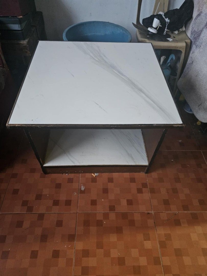 🤍 Handmade Side Table / Center Table - White Marble Design (Category: Tables & Sets) located in Cavite. Submitted by blu3writer (Listing ID 1469624361, Image 1). Description: 📍 General Trias, Cavite ✨ Gawa ng tatay ko kaya matibay! Hindi marupok, solid wood frame. ✔ White marble top + bottom storage ✔ No sira, good condition, matibay na matibay ✔ Perfect for sala, kwarto, or side table RFS: Decluttering lang, sayang hindi na nagagamit Pickup: G