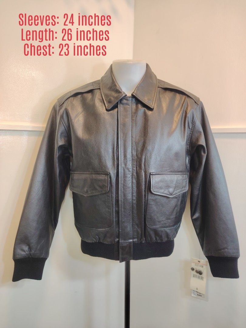 A-2 LEATHER FLIGHT JACKET (Category: Coats, Jackets and Outerwear) located in La Trinidad. Submitted by padasem_kadi (Listing ID 1469631999, Image 1). Description: - Style: Classic black leather bomber jacket - Condition: Brand new with original store tag attached - Details: Front zipper closure, rib-knit cuffs and hem, dual front flap pockets - Extras: Includes extra buttons - Size: Small - Measurements: Chest 23 inches, Length 26 inches, Sleeve