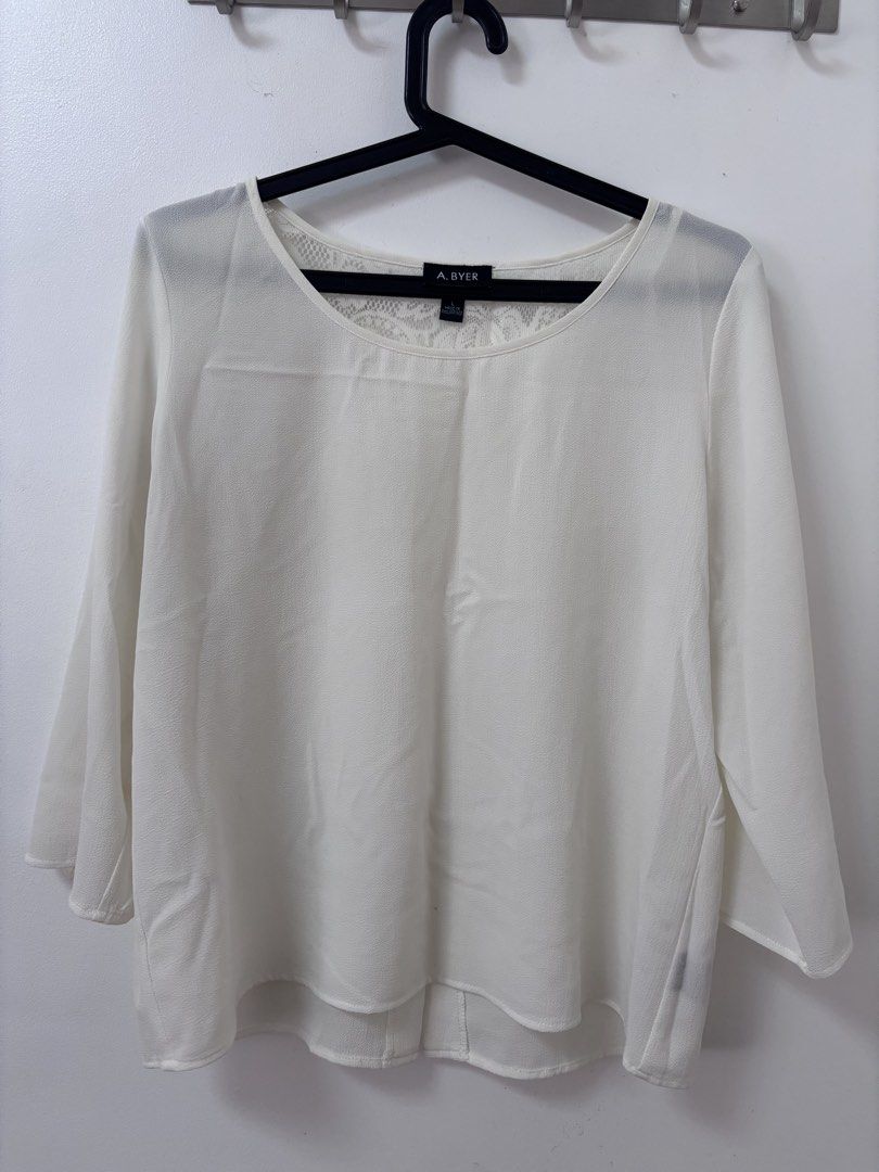 PRE-LOVED: A. Byer White Lace Back Blouse (Category: Blouses) located in Imus. Submitted by jertitay (Listing ID 1469632938, Image 1). Description: RFS: decluttering - Brand: A. Byer - Size: Large - Color: White - Style: Scoop neckline, 3/4 sleeves, and chic high-low hem - Detail: Stunning floral lace panel on the upper back with a center box pleat - Material: Lightweight, airy chiffon-like fabric - Condition: Excellent - Perfect for: Casual wear