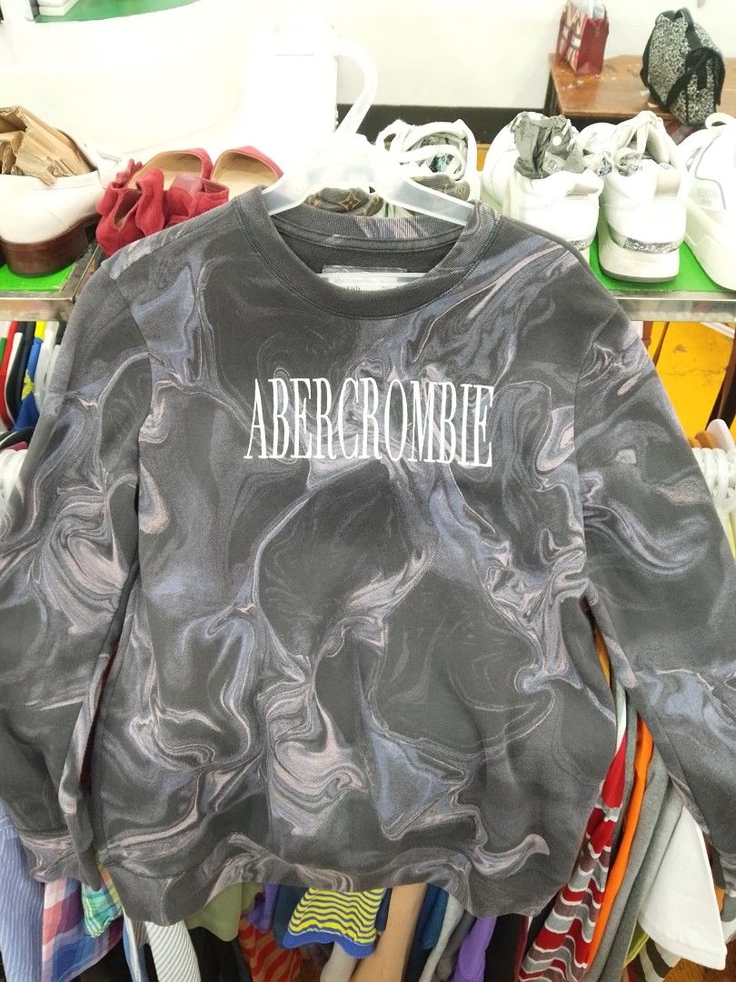 Abercrombie Marble Print Sweatshirt (Category: Longsleeves) located in Manila. Submitted by afreemf (Listing ID 1469644876, Image 1). Description: - Brand: Abercrombie & Fitch - Style: Crewneck sweatshirt with relaxed fit - Color/Pattern: Dark grey marble wash with bold white chest lettering - Details: Ribbed cuffs, collar, and hem for a snug fit - Condition: Excellent / Pre-loved (ready to wear) - Perfect for: Daily casual wear and effortless st