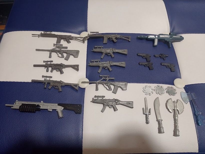 Action Figure Toy Weapons Guns Swords Set (Category: Action & Battle Toys) located in Quezon City. Submitted by susmaryosep1 (Listing ID 1469652953, Image 1). Description: - Lot of assorted miniature action figure weapons - Includes rifles, submachine guns, handguns, sci-fi blasters, throwing stars, knives, and axes - Mostly silver and grey plastic material - Great for figure customizing, diorama setups, or replacing lost accessories - All pieces