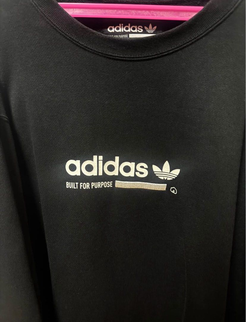 Adidas Black Crewneck Sweatshirt (Category: Coats, Jackets and Outerwear) located in Manila. Submitted by quintessesommerset (Listing ID 1469681080, Image 2). Description: - Brand: Adidas size M but can fit to XL - Style: Crewneck sweatshirt / Pullover - Color: Black with white graphic print ('BUILT FOR PURPOSE') - Size: Medium (M) - Details: Ribbed cuffs and hem - Origin: Made in Vietnam - Condition: Great for casual everyday wear - Fast shippin
