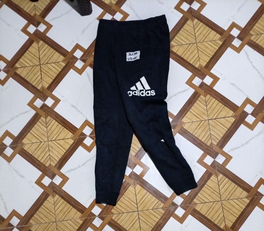 Adidas Black Joggers Pants DV1660 (Category: Joggers) located in Naga. Submitted by catimbange25697 (Listing ID 1469710716, Image 1). Description: - Brand: Adidas - Color: Black with large white logo on the leg - Material: Comfortable cotton and polyester blend - Fit: Regular fit with elastic waistband and adjustable drawstring - Origin: Made in Cambodia - Versatility: Ideal for workouts, lounging, or casual daily wear.