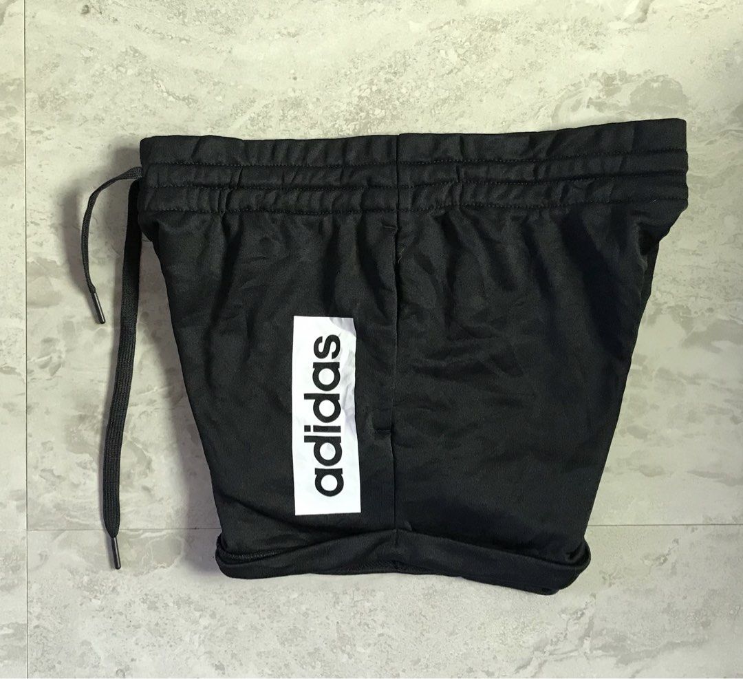 Adidas Black Shorts with Logo (Category: Shorts) located in Banga. Submitted by jorguarino (Listing ID 1469622793, Image 2). Description: Adidas athletic shorts in black. Size A/M (165/72A). Made of 100% recycled polyester main material with cotton blend pocket lining. Elastic waistband with drawstring. Bold white adidas vertical logo print on the leg. Manufactured in Cambodia..