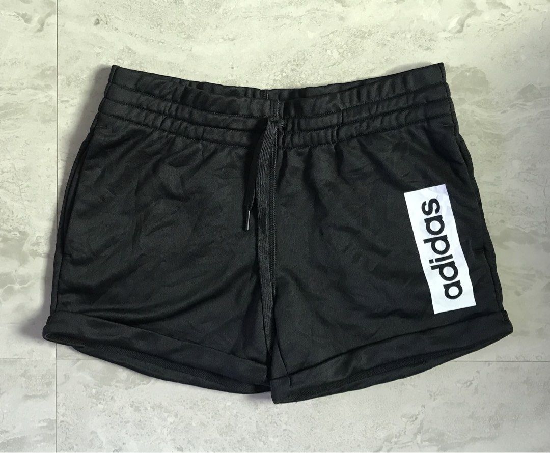 Adidas Black Shorts with Logo (Category: Shorts) located in Banga. Submitted by jorguarino (Listing ID 1469622793, Image 1). Description: Adidas athletic shorts in black. Size A/M (165/72A). Made of 100% recycled polyester main material with cotton blend pocket lining. Elastic waistband with drawstring. Bold white adidas vertical logo print on the leg. Manufactured in Cambodia..