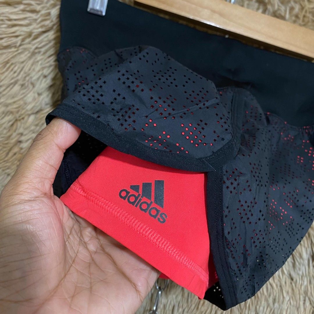 Adidas Climalite Double Layer Running Shorts Black Red (Category: Shorts) located in Butuan. Submitted by jcuabs (Listing ID 1469732829, Image 3). Description: - Brand: Adidas - Style: Climalite 2-in-1 running shorts with inner compression tights - Color: Black with bright red inner shorts and accents - Features: Perforated outer layer for airflow, wide stretchy waistband with Climalite logo, and Adidas branding on the leg - Condition: Excellent 