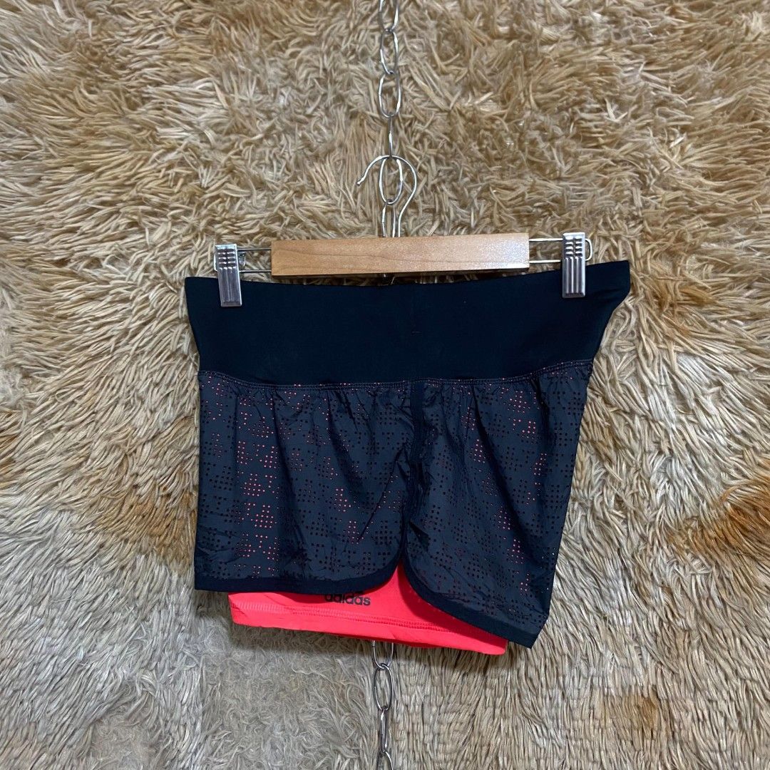 Adidas Climalite Double Layer Running Shorts Black Red (Category: Shorts) located in Butuan. Submitted by jcuabs (Listing ID 1469732829, Image 2). Description: - Brand: Adidas - Style: Climalite 2-in-1 running shorts with inner compression tights - Color: Black with bright red inner shorts and accents - Features: Perforated outer layer for airflow, wide stretchy waistband with Climalite logo, and Adidas branding on the leg - Condition: Excellent 