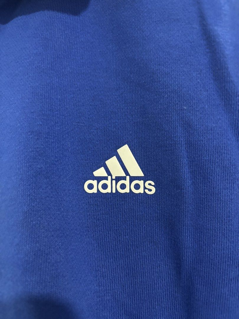 Adidas Climalite Full Zip Track Jacket Blue Red XL (Category: Coats, Jackets and Outerwear) located in Calbayog City. Submitted by zaxcheus_castillo1708 (Listing ID 1469667969, Image 3). Description: - Brand: Adidas - Style: Full-zip track jacket with stand-up collar and side pockets - Color: Blue body with red collar, cuffs, and hem, plus white accents - Details: White three-stripe sleeves and printed Adidas logo on the chest - Technology: Clima