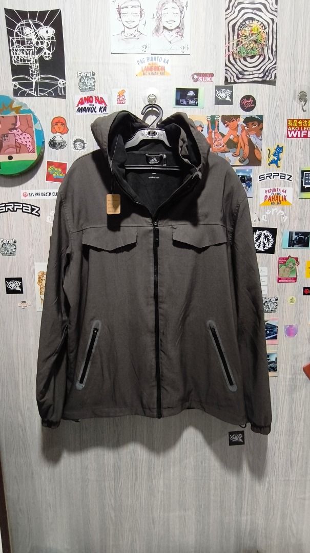 Adidas Climaproof Grey Hooded Jacket (Category: Coats, Jackets and Outerwear) located in Davao. Submitted by thethriftproject082 (Listing ID 1469748801, Image 1). Description: - Brand: Adidas - Color: Grey - Condition: Brand new with tags attached - Technology: Climacool for dryness and comfort - Closure: Full front zip - Storage: 2 chest flap pockets and 2 lower zippered pockets - Fit & Adjustability: Adjustable cuffs and drawcord hem - Extra Fe