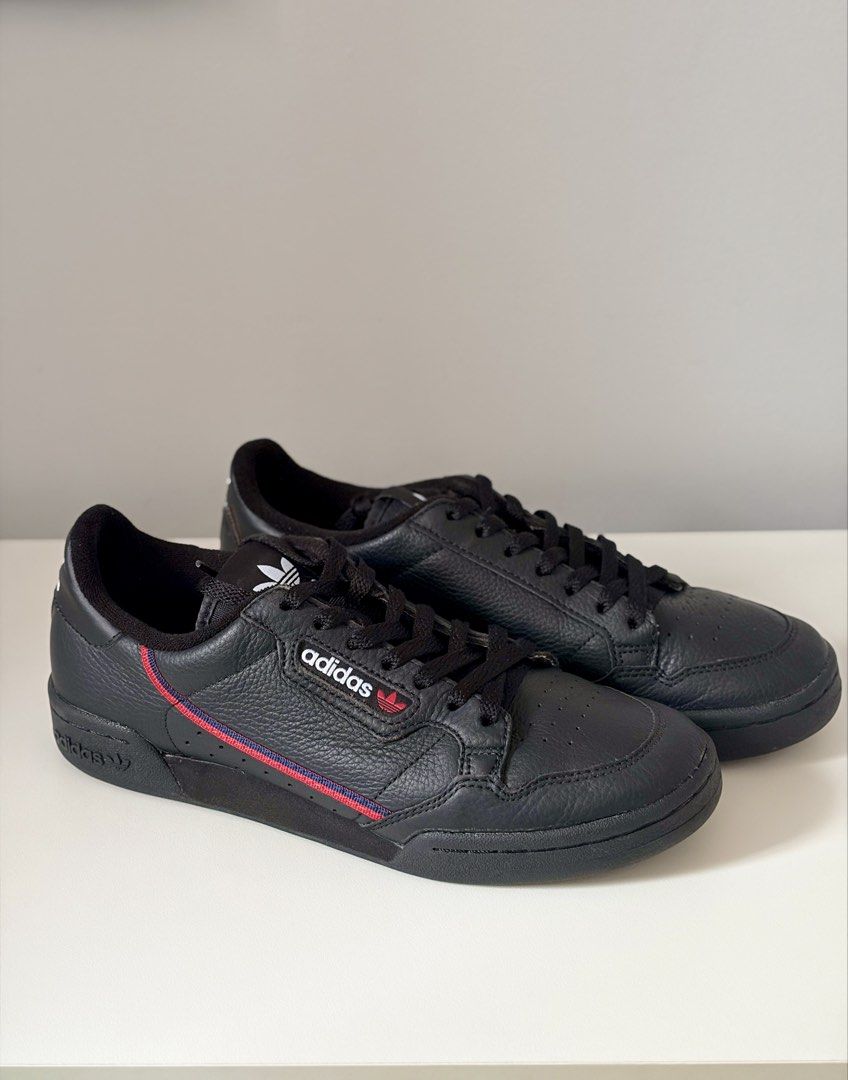 Adidas Continental 80 Black Sneakers (Category: Sneakers) located in Mandaluyong City. Submitted by luckyphoenix_88ff96 (Listing ID 1469648087, Image 1). Description: - Brand: Adidas Continental 80 - Colorway: Black tumbled leather with red and blue stripe details - Details: White branding on tongue, side, and heel with matching black laces and rubber cupsole - Condition: Very clean uppers and nicely maintained soles - Style: Great everyday casua