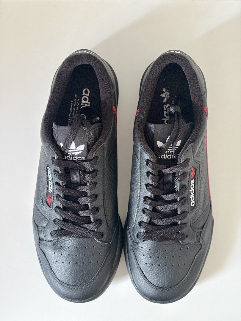 Adidas Continental 80 Black Sneakers (Category: Sneakers) located in Mandaluyong City. Submitted by luckyphoenix_88ff96 (Listing ID 1469648087, Image 3). Description: - Brand: Adidas Continental 80 - Colorway: Black tumbled leather with red and blue stripe details - Details: White branding on tongue, side, and heel with matching black laces and rubber cupsole - Condition: Very clean uppers and nicely maintained soles - Style: Great everyday casua
