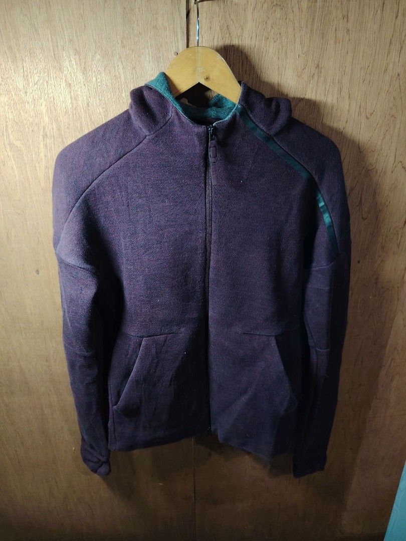 Adidas Maroon Zip Up Hoodie (Category: Coats, Jackets and Outerwear) located in Baguio. Submitted by tabuzomaria1422 (Listing ID 1469701072, Image 1). Description: - Brand: Adidas - Color: Maroon with teal green inner hood - Features: Full zip front, two side pockets, ribbed cuffs and hem - Detail: Signature Adidas logo printed on the right sleeve - Material: Textured fabric - Fit: Regular fit - Condition: Great everyday jacket for cooler weather