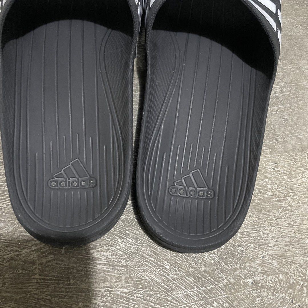 Adidas Slides OG • Size 9 US (Category: Slippers & Slides) located in Marikina City. Submitted by icecoldstrategy. (Listing ID 1469699520, Image 3). Description: For sale di ko na nagagamit, pinaka OG na tsinelas ng adidas dati. If you know you know. Sobrang solid nito full rubber. Size 9 on tag (can fit to 8.5 to 9) Authentic 100% May mga scratches lang sa white lines pero para sakin yan yung mas nagpapaganda dyan habang tumatagal. Location : Ma