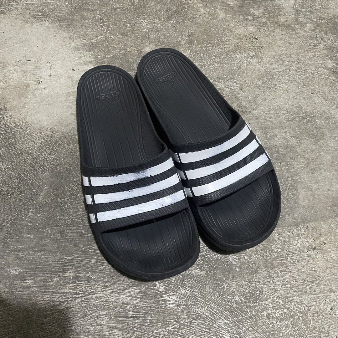Adidas Slides OG • Size 9 US (Category: Slippers & Slides) located in Marikina City. Submitted by icecoldstrategy. (Listing ID 1469699520, Image 1). Description: For sale di ko na nagagamit, pinaka OG na tsinelas ng adidas dati. If you know you know. Sobrang solid nito full rubber. Size 9 on tag (can fit to 8.5 to 9) Authentic 100% May mga scratches lang sa white lines pero para sakin yan yung mas nagpapaganda dyan habang tumatagal. Location : Ma