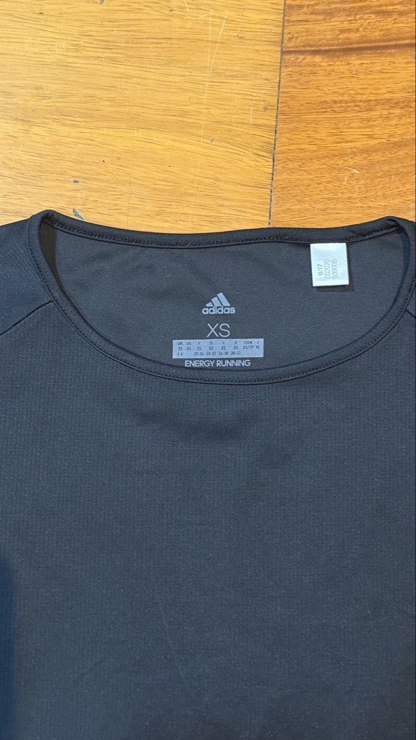 Adidas Women's Running Tshirt (Category: Activewear) located in Makati City. Submitted by thevault88 (Listing ID 1469694396, Image 3). Description: - Brand: Adidas - Style: Running top / Athletic wear - Color: Black - Size: Women's Extra Small (XS) - Features: Breathable fabric, reflective sleeve details, small hem logo, crew neckline, short sleeves - Condition: Clean inside and out, no flaws - Ideal for: Gym sessions, running, and workouts.