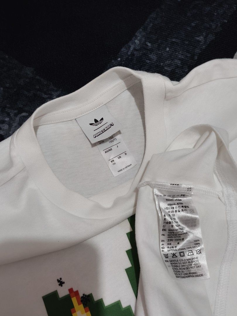 Adidas x Minecraft (Category: Tshirts & Polo Shirts ) located in Andop. Submitted by kyutoryuu (Listing ID 1469582020, Image 3). Description: Adidas x Minecraft •Dimes: 20x25 •Condition: Excellent •CR: 9.5/10 •Issue: need rewash.
