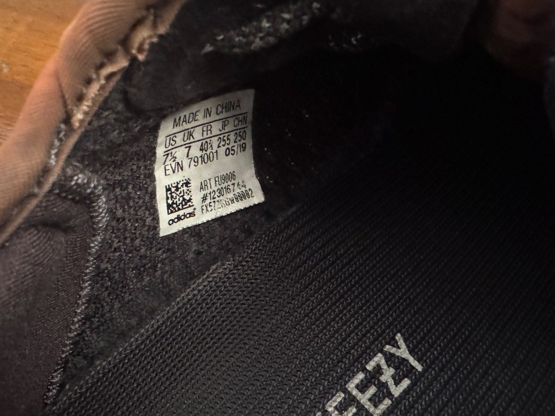 Adidas Yeezy Boost 350 V2 Black Static Reflective (Category: Sneakers) located in Pasig City. Submitted by archive.project (Listing ID 1469625361, Image 2). Description: - Brand: Adidas Yeezy Boost 350 V2 (Art No: FU9006, Prod: 05/19) - Size: US 7.5 / UK 7 / FR 40 2/3 - Color/Design: Black Primeknit upper, reflective laces, signature side stripe, and contrast brown interior collar lining - Condition: Clean soles, well-maintained knit texture, and