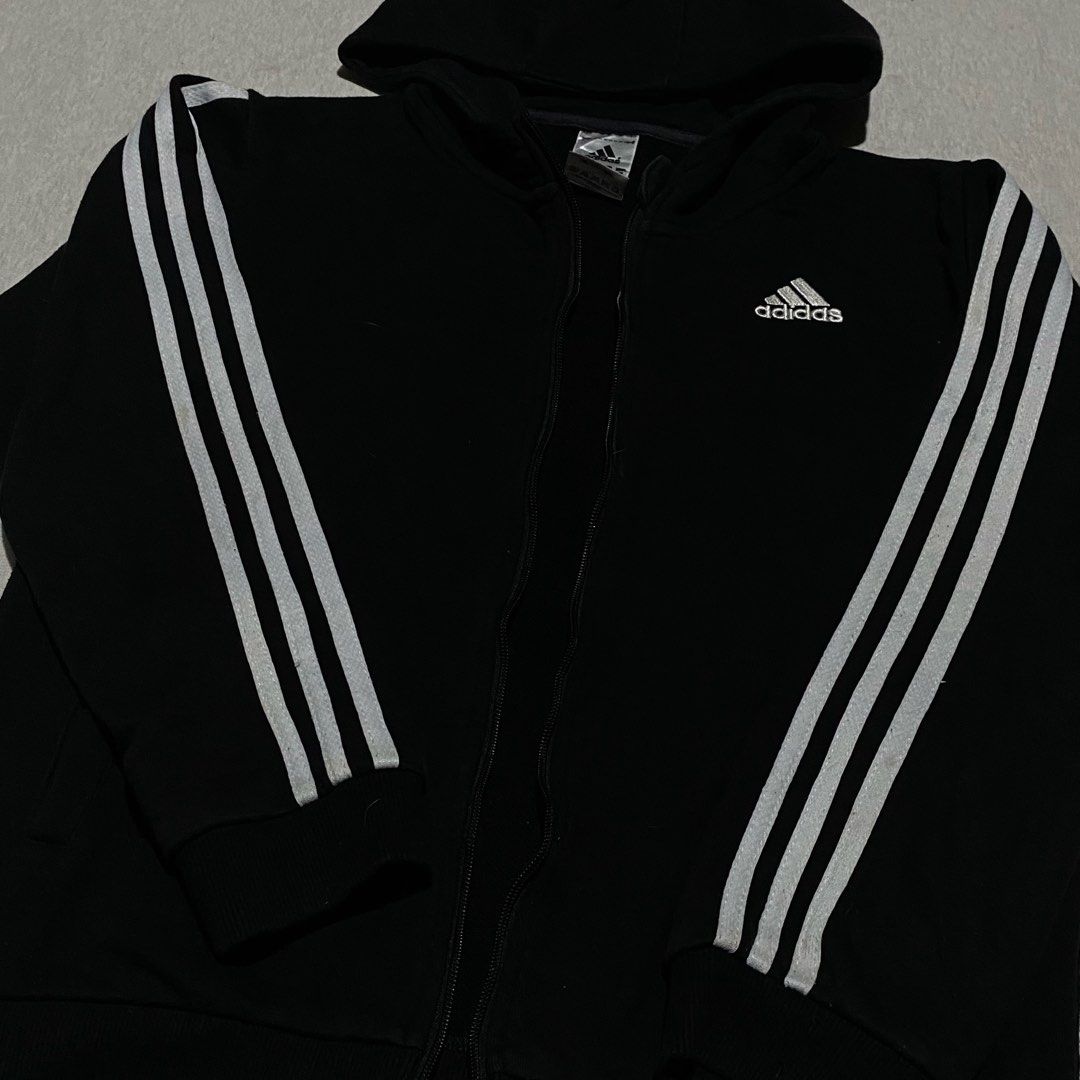 Adidas Zip Jacket (Category: Coats, Jackets and Outerwear) located in Mabalacat. Submitted by stellargarments (Listing ID 1469734589, Image 3). Description: Length : 24 Width : 19 Condition : 8.5/10 solid burda all logos working zipper with 2 pockets cotton fabric medjo lukot pa po need wash fresh from bale color may vary due to lighting minimal lints pero hindi pansinin since black din .