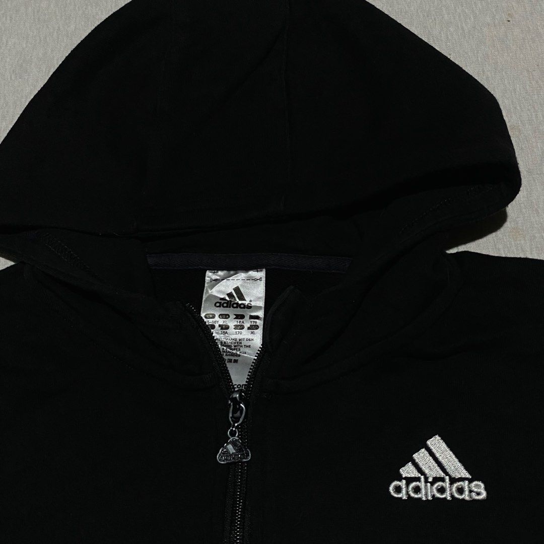 Adidas Zip Jacket (Category: Coats, Jackets and Outerwear) located in Mabalacat. Submitted by stellargarments (Listing ID 1469734589, Image 2). Description: Length : 24 Width : 19 Condition : 8.5/10 solid burda all logos working zipper with 2 pockets cotton fabric medjo lukot pa po need wash fresh from bale color may vary due to lighting minimal lints pero hindi pansinin since black din .