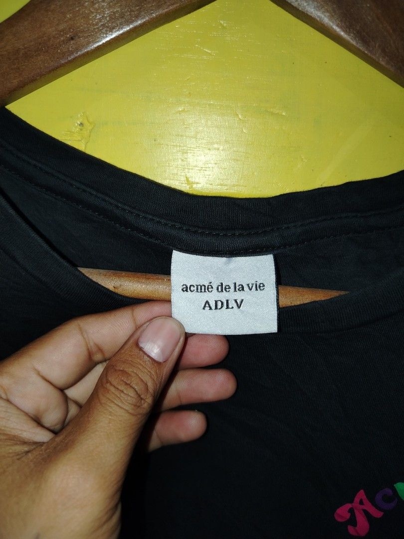 ADLV Black Donut Graphic Tee Size L (Category: Tshirts & Polo Shirts ) located in Caloocan City. Submitted by vincefresn21903 (Listing ID 1469668046, Image 3). Description: - Brand: Acme de la Vie (ADLV) - Color: Black - Size: L (Relaxed streetwear fit) - Material: Soft, premium cotton - Design: Subtle graphic print on the front chest and bold multicolored lettering on the back - Authenticity: Verified neck and size tags attached.