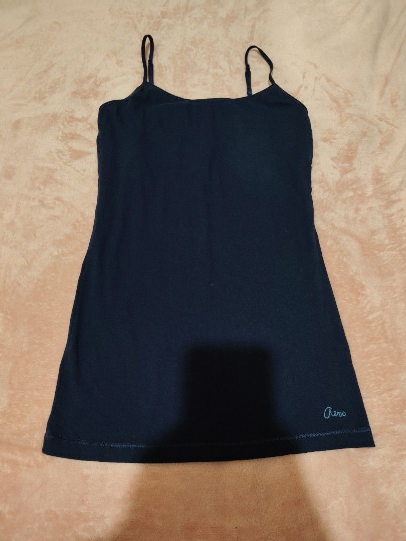 Aeropostale Favorite Cami Navy (Category: Sleeveless) located in Villasis. Submitted by trip_thrift15 (Listing ID 1469697725, Image 1). Description: - Brand: Aeropostale - Style: Favorite Cami - Color: Navy Blue - Size: Medium (M) - Material: 95% Cotton, 5% Spandex (Stretchable & comfortable) - Features: Adjustable spaghetti straps, embroidered Aero logo near bottom hem - Care: Machine washable - Flaw: Minor tiny speck mark on the fabric flaws-do