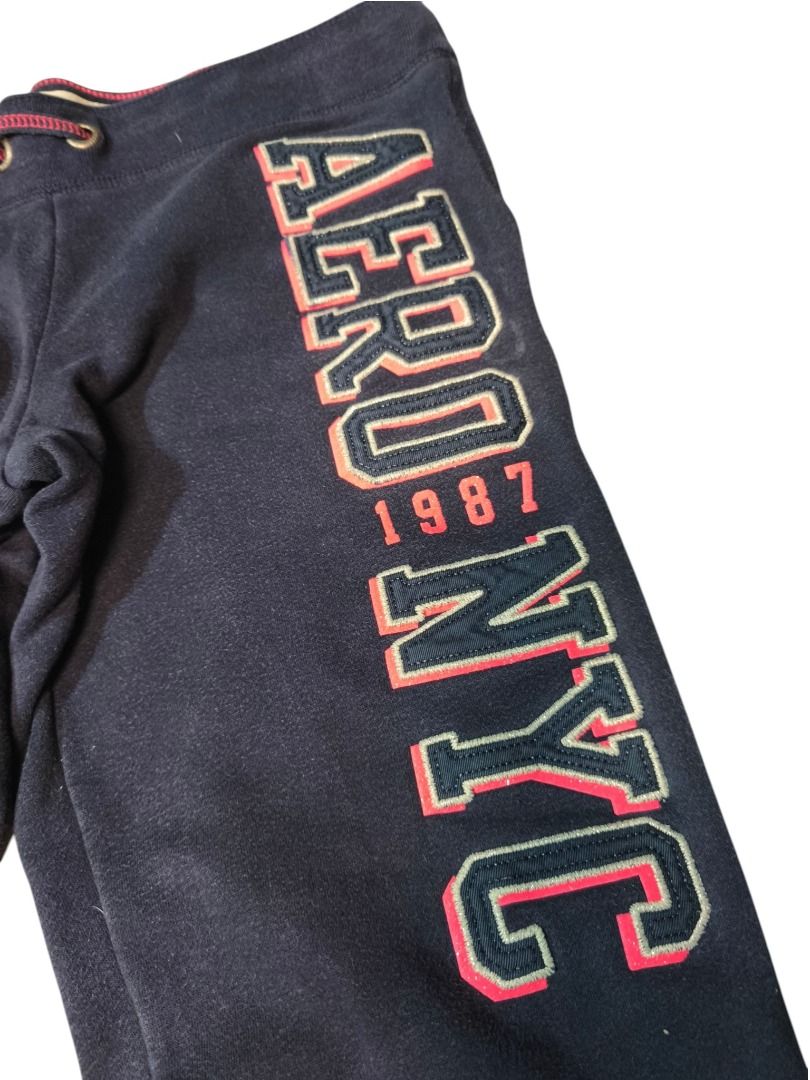 Aeropostale NYC 1987 Sweatpants (Category: Activewear) located in Baguio. Submitted by boneteezandharmony (Listing ID 1469663599, Image 3). Description: Classic navy Aeropostale sweatpants featuring bold NYC 1987 lettering with contrasting red and cream details. Finished with a drawstring waistband and elastic ankle cuffs for a sporty, casual look. .