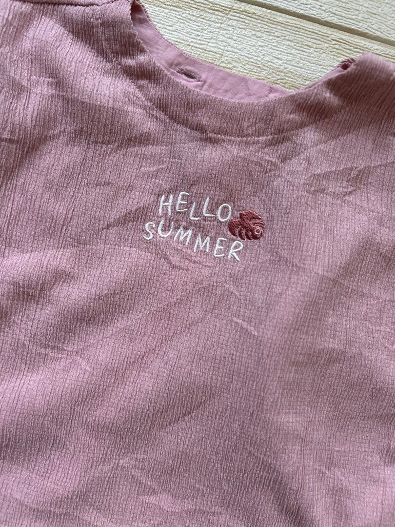 Agabang dusty rose top 24m (Category: Babies & Kids Fashion) located in Cebu City. Submitted by yjainani (Listing ID 1469577078, Image 2). Description: dusty rose or pink textured waffle-knit baby or toddler t-shirt featuring rolled short sleeves, an embroidered "Hello Summer" graphic on the chest, and a split back hem design.