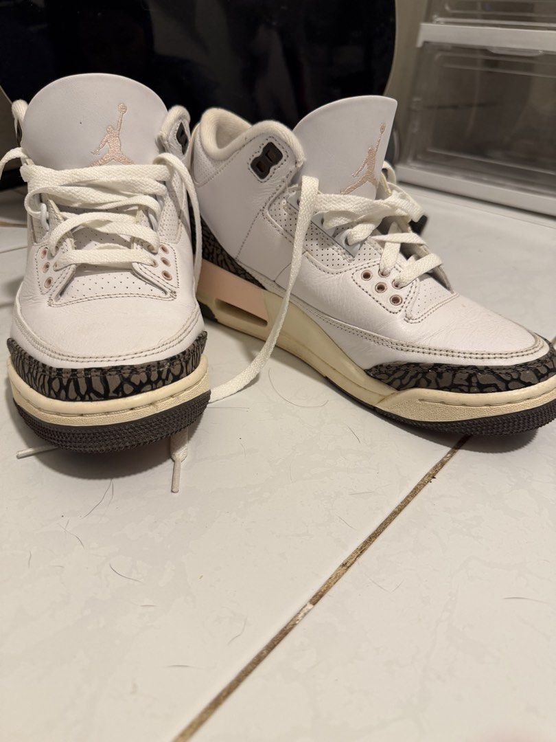 Air Jordan 3 Retro Rust Pink Sneakers (Category: Sneakers) located in Angono. Submitted by wisepenguin.ba57f4 (Listing ID 1469645445, Image 1). Description: - Model: Air Jordan 3 Retro (White and Rust Pink) - Upper: White leather with classic elephant print overlays on the toe and heel - Branding: Embroidered Jumpman logos on the tongues - Sole: Yellowed midsoles with visible air units - Condition: Some creasing on the toe boxes, minor wear along