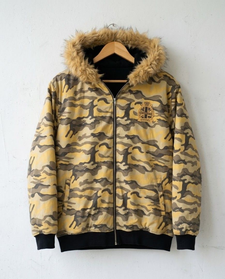 Akademiks Reversible Fur-Trimmed Camo Jacket ( (Category: Coats, Jackets and Outerwear) located in Baguio. Submitted by luxeloomarchive (Listing ID 1469612363, Image 1). Description: Akademiks Reversible Fur-Trimmed Camo Jacket (Size XXL) ​Get two looks in one with this heavy-duty Akademiks reversible hoodie jacket. Switch easily between a bold desert camo print and a sleek black outer shell. ​2-in-1 Design: Reverses from full camo to classic bla