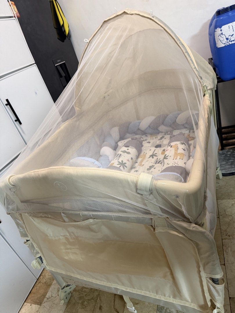 Akeeva Luxury CO-SLEEPER Playpen/ crib (Category: Cots & Cribs) located in General Trias. Submitted by jaymmielle (Listing ID 1469601752, Image 3). Description: - di kasama bumper, bedsheet and pillows - Brand/Model: Akeeva B.SIDE ME playpen - Design: Khaki animal print with extra blue-and-grey - Mobility: Wheels on one side for easy moving around the room - Condition: Sturdy build, clean, and ready for use - Features: Multi-functional setup for 
