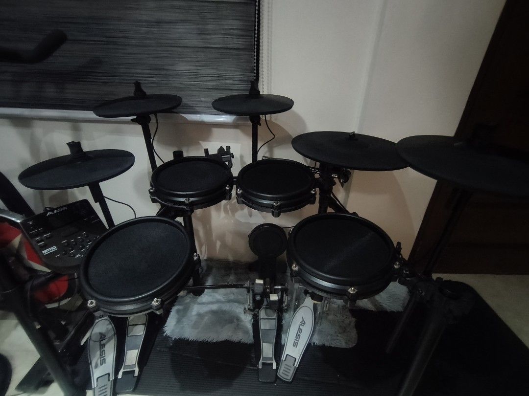 Alesis Nitro Electronic Drum Kit Double Pedal with extra cymbals (Category: Musical Instruments) located in Rizal. Submitted by norkizz92 (Listing ID 1469650124, Image 3). Description: - Alesis Nitro electronic drum set (fully functional & well-maintained) - Includes mesh drum pads, cymbals, sound module, and sticks - Comes with a comfortable drum stool/throne - Upgraded with a double bass pedal setup - Perfect for practice and recording - Pickup