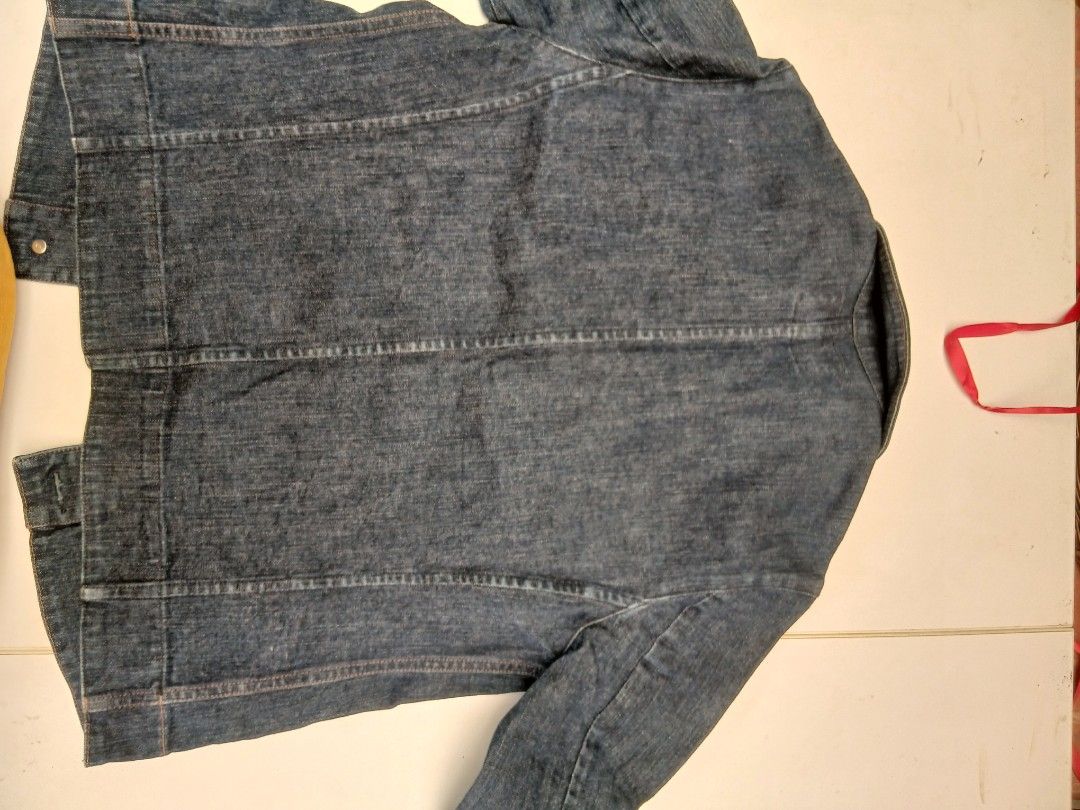 Alfaspin Blue Denim Jacket (Category: Coats, Jackets and Outerwear) located in Cainta. Submitted by chickennuggirl (Listing ID 1469589086, Image 2). Description: - Brand/Model: Alfaspin Denim Jacket - Color: Classic dark blue wash - Design: Classic collar, metal button-up front, and contrast stitching - Features: Long sleeves, two functional front pockets, and panel seam construction on the back - Fit: Structured and stylish.