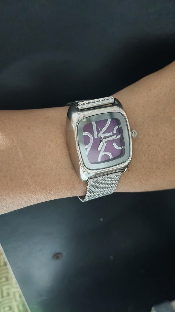 Alviero Martini Square Dial Watch with Purple Face (Category: Women's Watches) located in Taguig. Submitted by mercyeugen28914 (Listing ID 1469723880, Image 3). Description: - Brand: Narmi - Case: Silver-tone square with rounded corners - Dial: Deep purple with oversized stylish numerals - Strap: Fine silver mesh - Condition: Keeps time well, clean glass, normal everyday wear on casing.