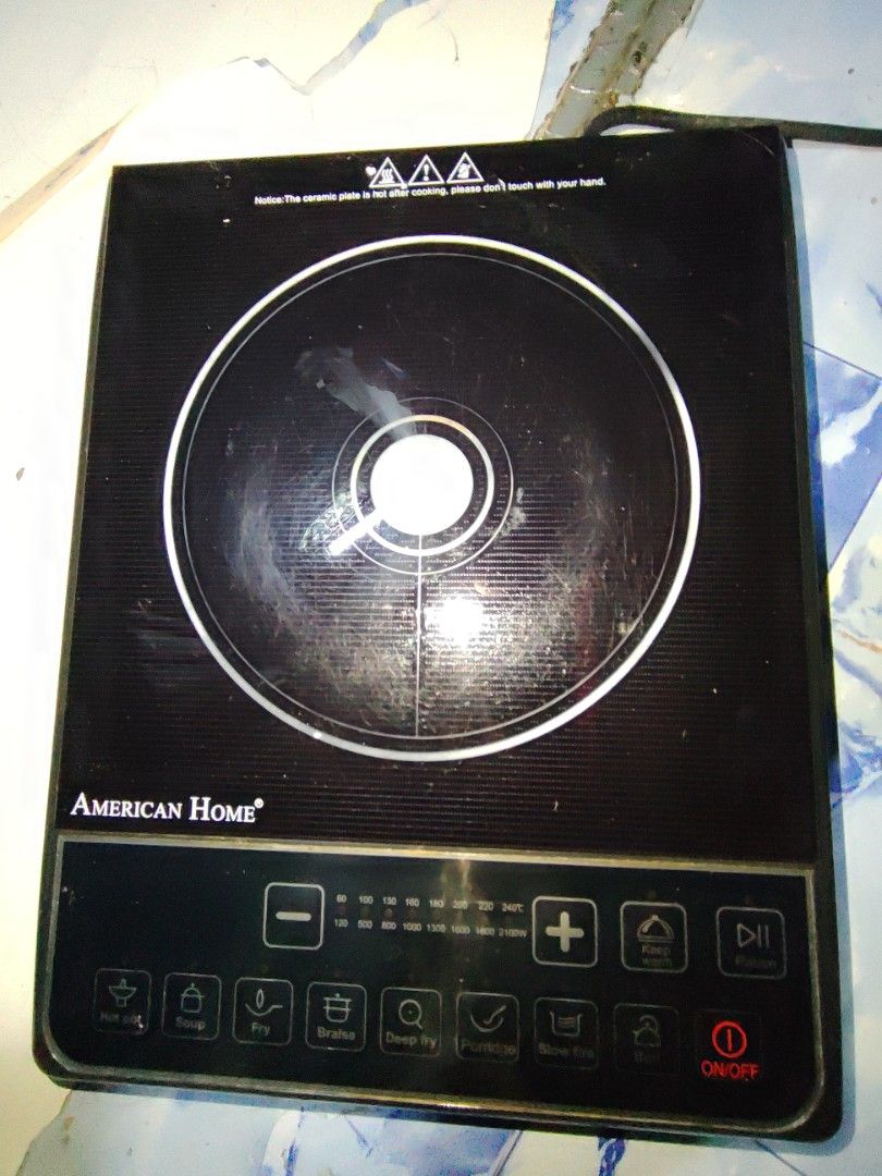 American Home Induction Cooker with Pot (Category: Cookers) located in Manila. Submitted by vastearth_3748fa (Listing ID 1469585951, Image 1). Description: - Brand: American Home - Design: Sleek black glass top - Features: Multiple touch cooking modes including hot pot, fry, and soup - Inclusions: Stainless steel pot with lid and original box - Condition: Complete set, great for everyday cooking.