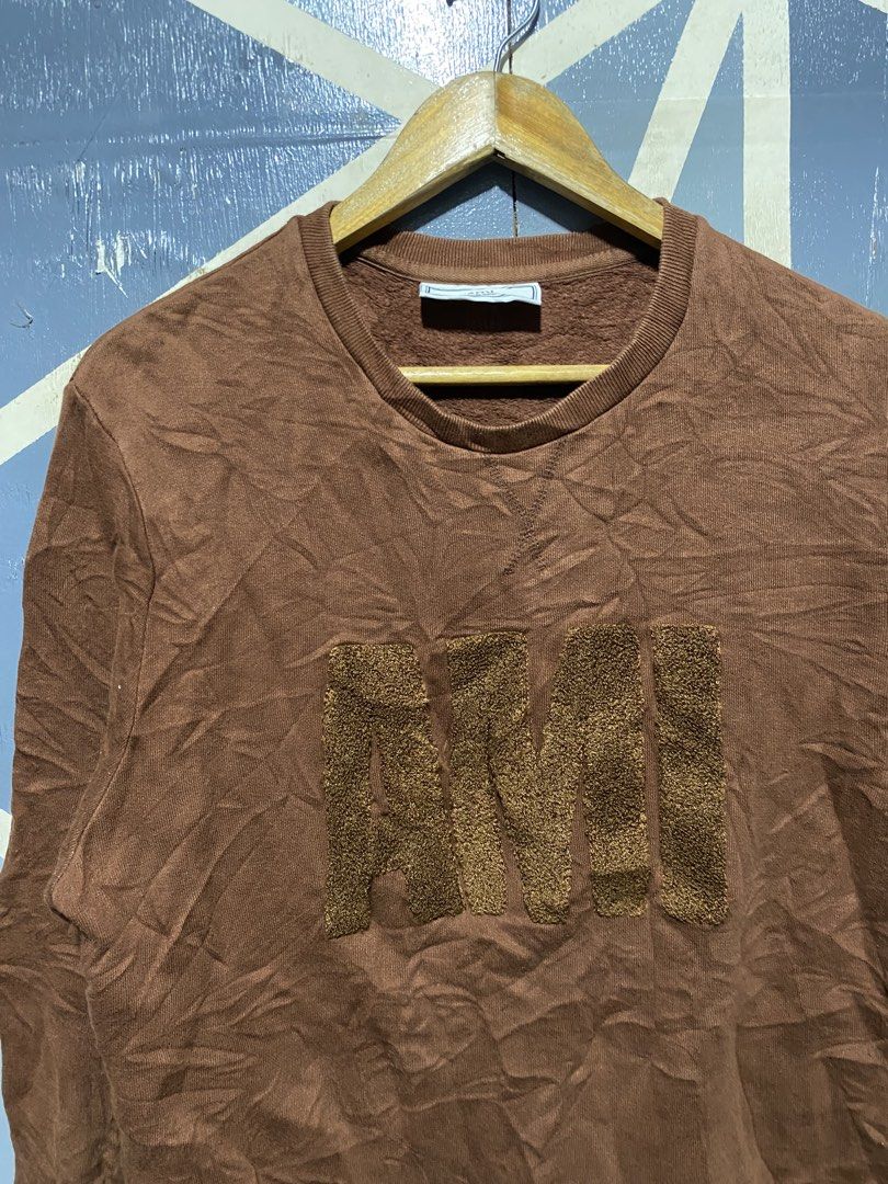 Ami Alexandre Mattiussi Brown Sweatshirt Size M (Category: Coats, Jackets and Outerwear) located in Polomolok. Submitted by marrssz (Listing ID 1469678430, Image 3). Description: - Brand: Ami Alexandre Mattiussi - Color: Brown - Size: Medium - Design: Textured chenille logo lettering on chest, classic crewneck - Comfort: Soft fleece interior lining with ribbed cuffs and hem - Condition: Lightly worn, carefully stored, clean overall shape -DIMES [