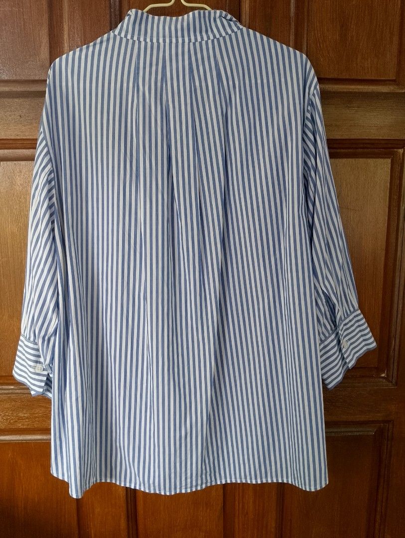 Ann Klein Heritage Collection 3/4 Sleeves Top (Category: Others Tops) located in Cabadbaran. Submitted by ztsfinds (Listing ID 1469649866, Image 2). Description: Anne Klein Heritage Collection Striped Cotton Blouse - It features a timeless blue and white vertical stripe pattern, elevated by a striking, colorful abstract floral patch pocket on the chest. -Made of 100% premium, breathable cotton—perfect for keeping cool while looking put together. 