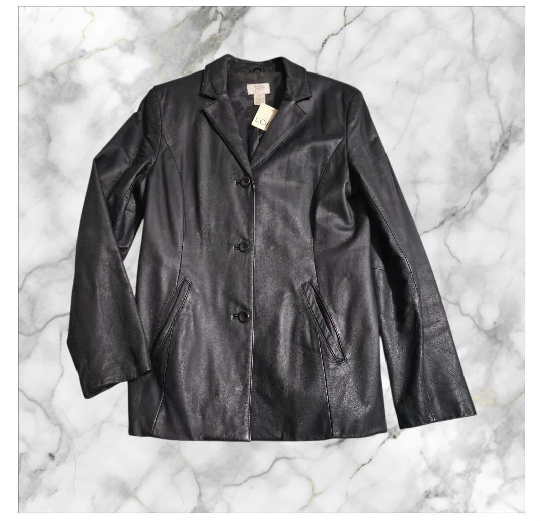 Ann Taylor Loft Black Leather Jacket Size Medium (Category: Coats, Jackets and Outerwear) located in Paranaque City. Submitted by calm_youngstore7 (Listing ID 1469616801, Image 2). Description: - Brand: Ann Taylor Loft - Style: Classic black leather blazer with 3-button front closure - Condition: Brand new with tags (BNWT) - Features: Fully lined interior, two front pockets, and a chic back panel seam detail - Measurements: Pit to pit 19" | Lengt