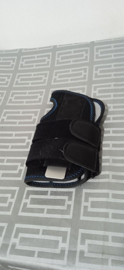 Aolikes Wrist Brace Support Splint Strap (Category: Braces, Support & Protection) located in Manila. Submitted by 1rom_sns (Listing ID 1469576247, Image 2). Description: - Brand: Aolikes - Color: Black with blue stitching - Support: Built-in rigid splint for extra stability and support - Fit: Adjustable straps with secure Velcro closure - Condition: Clean fabric, minimal wear - Ideal for: Sports activities and injury recovery Sta.Ana Manila Lalam