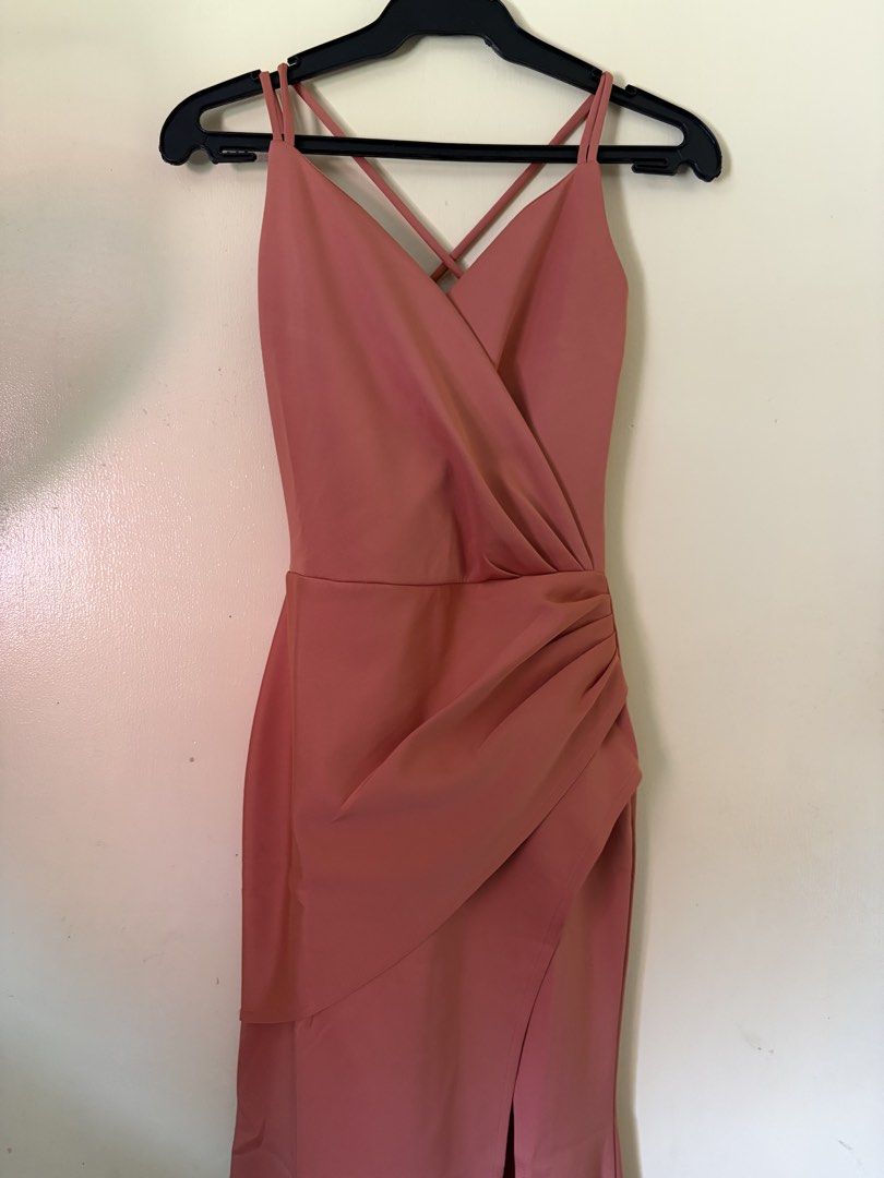 Apartment 8 clothing (Category: Dresses) located in Malabon City. Submitted by icooooooo (Listing ID 1469618439, Image 1). Description: - Color: Dusty pink - Length: Long dress - Details: Wrapped bodice, side gathering, draped skirt, front slit, and crisscrossing thin double straps - Closure: Side zipper - Fabric: Stretchy - Condition: Worn once for a few hours - Fit: True to size.