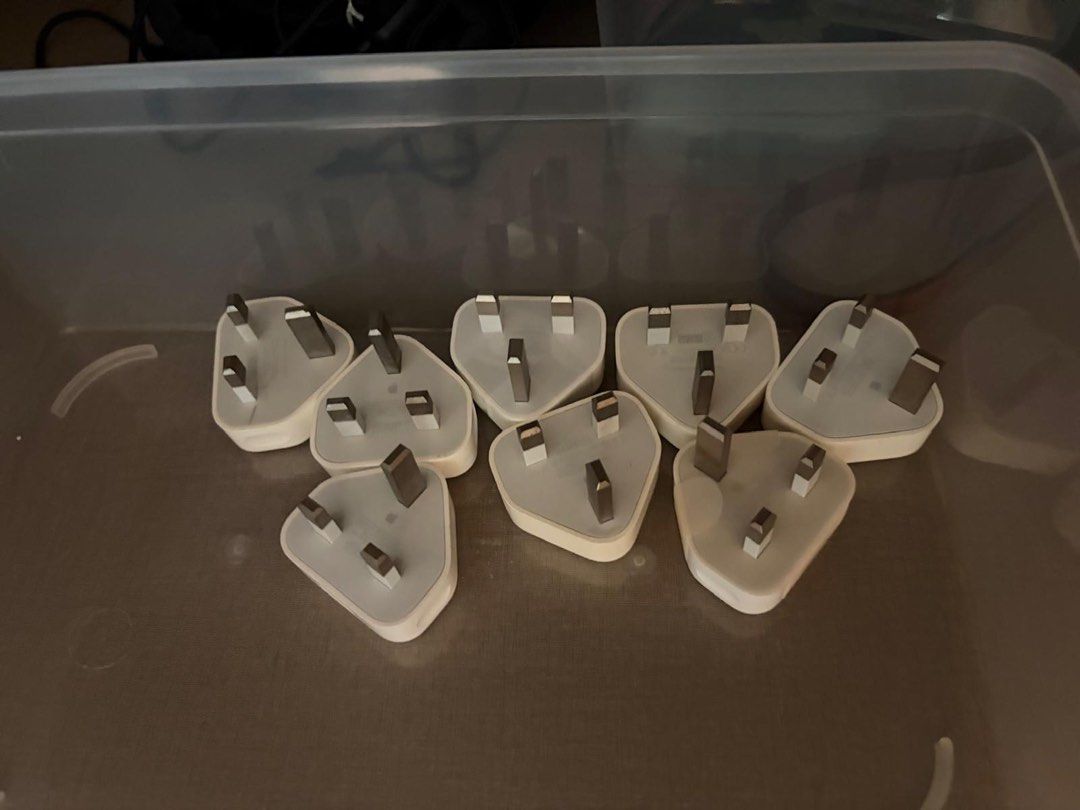 Apple authentic charging adapters (Category: Chargers & Cables) located in Singapore. Submitted by mattselling_81445452 (Listing ID 1469611607, Image 1). Description: Each $15 Original from Apple Singapore .