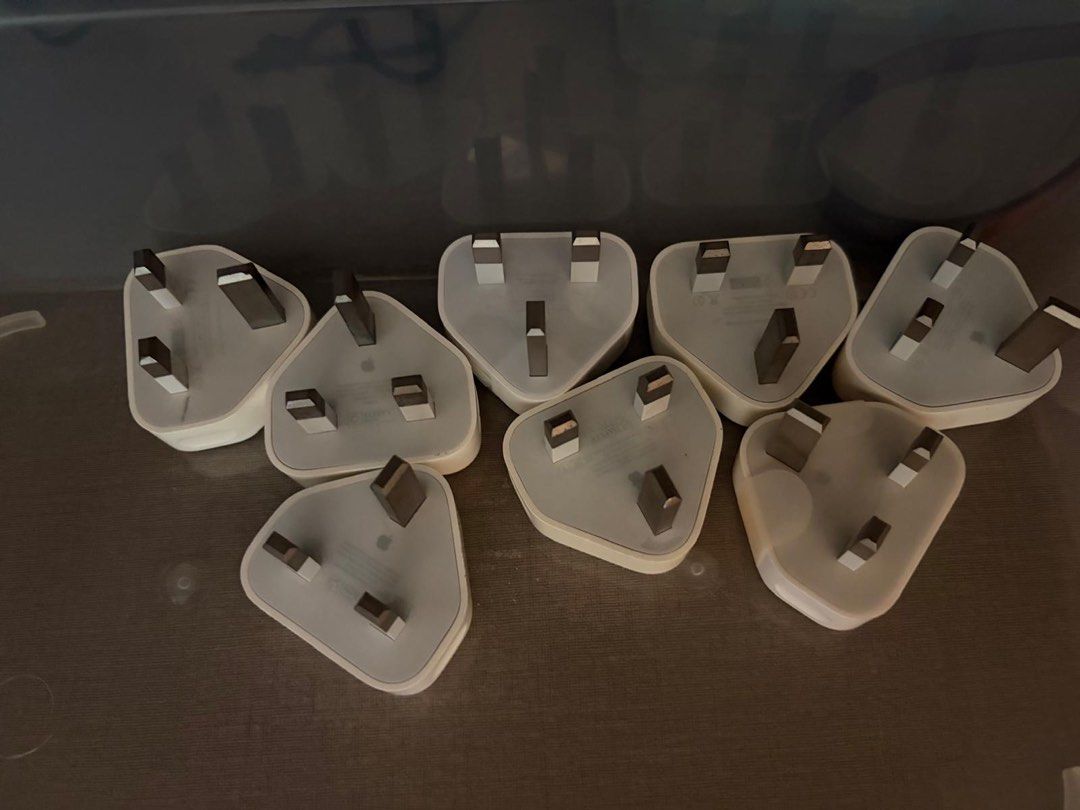 Apple authentic charging adapters (Category: Chargers & Cables) located in Singapore. Submitted by mattselling_81445452 (Listing ID 1469611607, Image 2). Description: Each $15 Original from Apple Singapore .