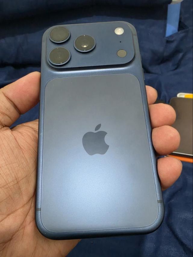 Apple iPhone 17 Pro Blue (Category: iPhone 17 Series) located in Gerona. Submitted by ernestorosaljr29 (Listing ID 1469575203, Image 3). Description: - Model: iPhone 17 Pro - Color: Blue - Condition: Excellent, clean edges with no dents or scratches -NO HIDDEN DEFECT -NO HISTORY OF REPAIR - 1 TB phone storage -90% Battery health -387 and counting Cycle count -Complete: box with the same IMEI, Unused cord, free cases. - warranty will end on Octobe