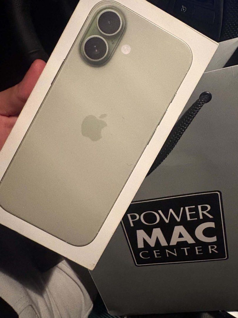 Apple iPhone Green (Category: iPhone 17 Series) located in Quezon City. Submitted by maemae482580600 (Listing ID 1469703534, Image 3). Description: Green iPhone model. Dual cameras on the back with metal lens protector rings. Original box and Power Mac Center paper bag included. Battery health at 93 percent with 321 cycle counts. Clean screen and back glass..