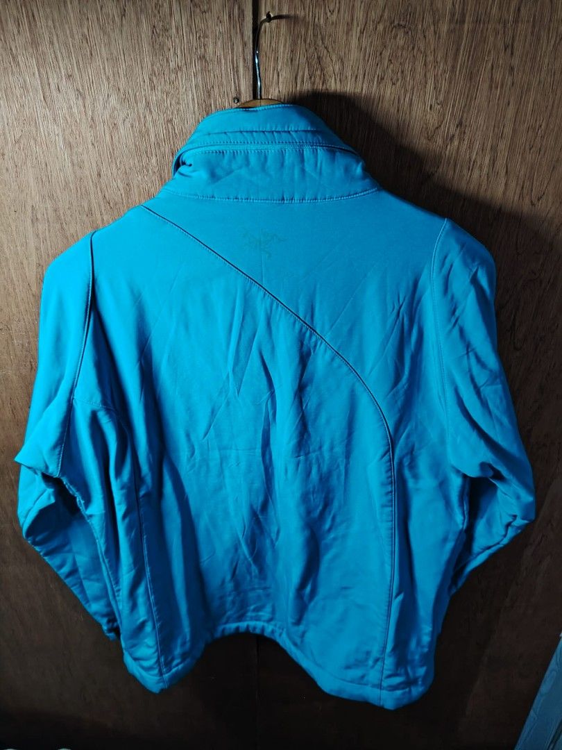 Arc'teryx Women's Blue Softshell Jacket Size L (Category: Coats, Jackets and Outerwear) located in Baguio. Submitted by tabuzomaria1422 (Listing ID 1469700908, Image 2). Description: - Brand: Arc'teryx - Item: Women's Softshell Jacket - Color: Bright Blue with contrast interior lining - Size: L (fits 39-inch bust) - Features: Full zip with YKK hardware, dual zippered hand pockets, high collar - Branding: Iconic Archaeopteryx fossil logo on chest 